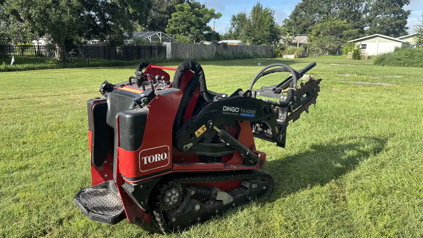 Westchase new irrigation installation — Toro Dingo trencher on job site in Tampa Bay