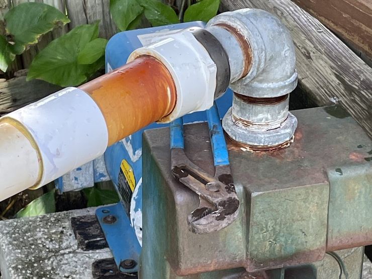 Lake-drawn irrigation pump with corroded discharge piping at a Tampa, FL waterfront property